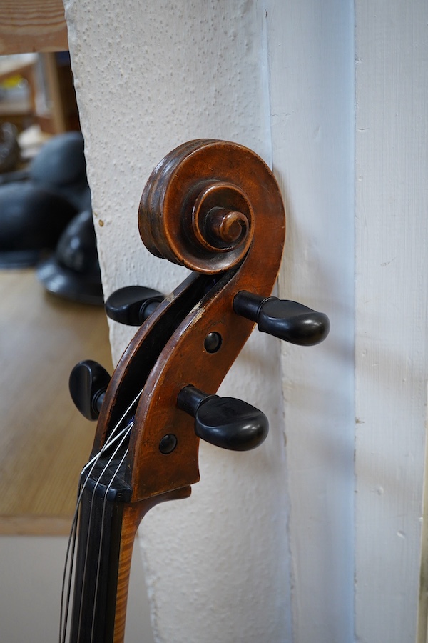 An early to mid 19th century German cello, attributed to Simon Voigt, Simon Voigt label inside with indistinct date, body 74.5cm, with a hard case. Condition - fair to good.